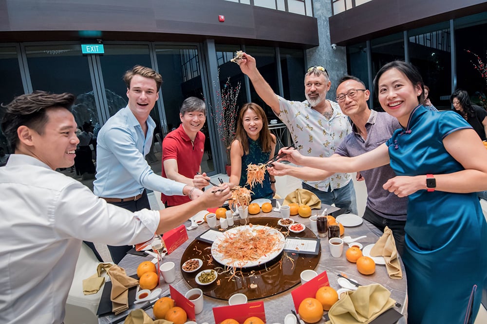 Guests tossing Yu Sheng to usher in the Year of the Rat 